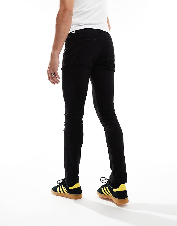 COLLUSION mid rise skinny jeans in washed black