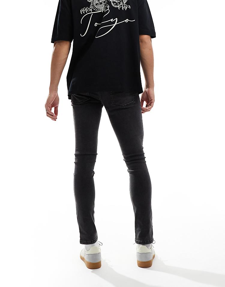 COLLUSION mid rise skinny jeans in washed black