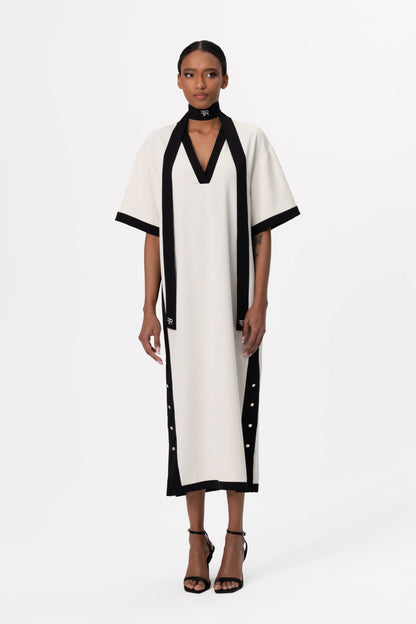 Discover the perfect harmony of contemporary elegance and sophisticated allure with Freisi Milk Color V-Neck Dress