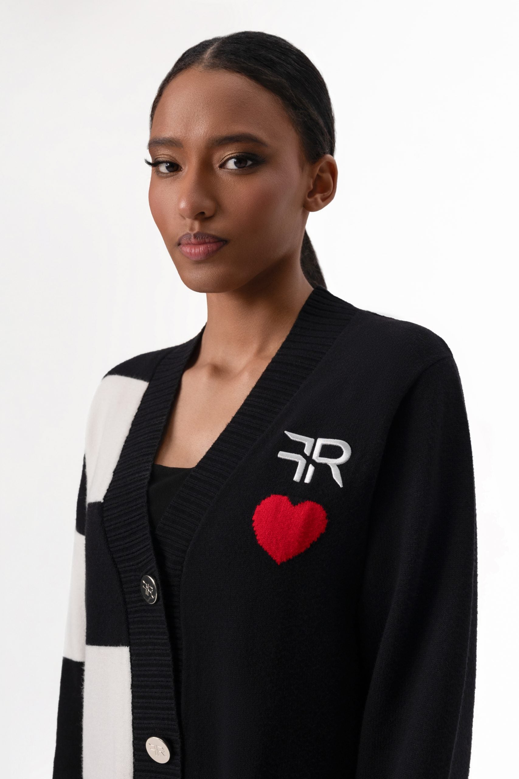 Immerse yourself in the epitome of sophistication with Freisi V-Neckline Cardigan