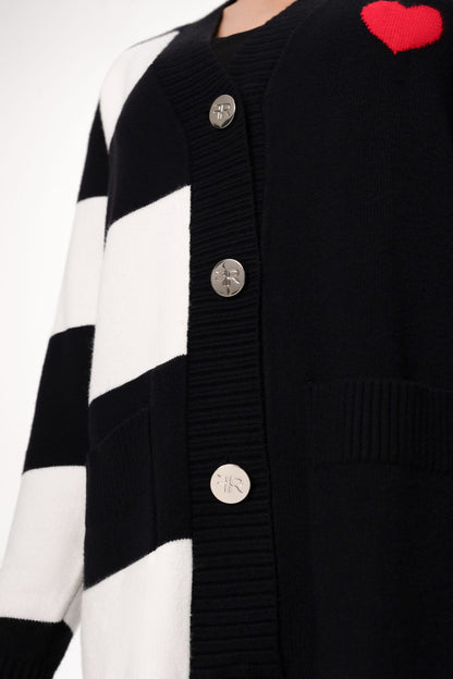 Immerse yourself in the epitome of sophistication with Freisi V-Neckline Cardigan