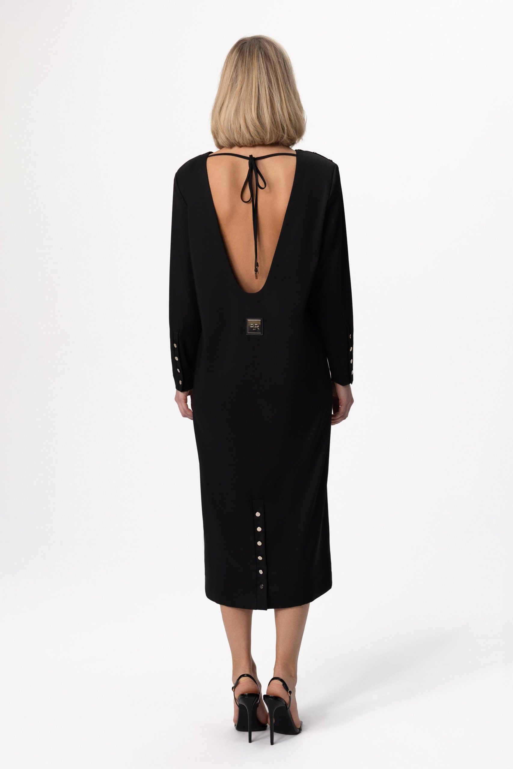 Indulge in the epitome of sophistication with our Elegant Open-Back Dress