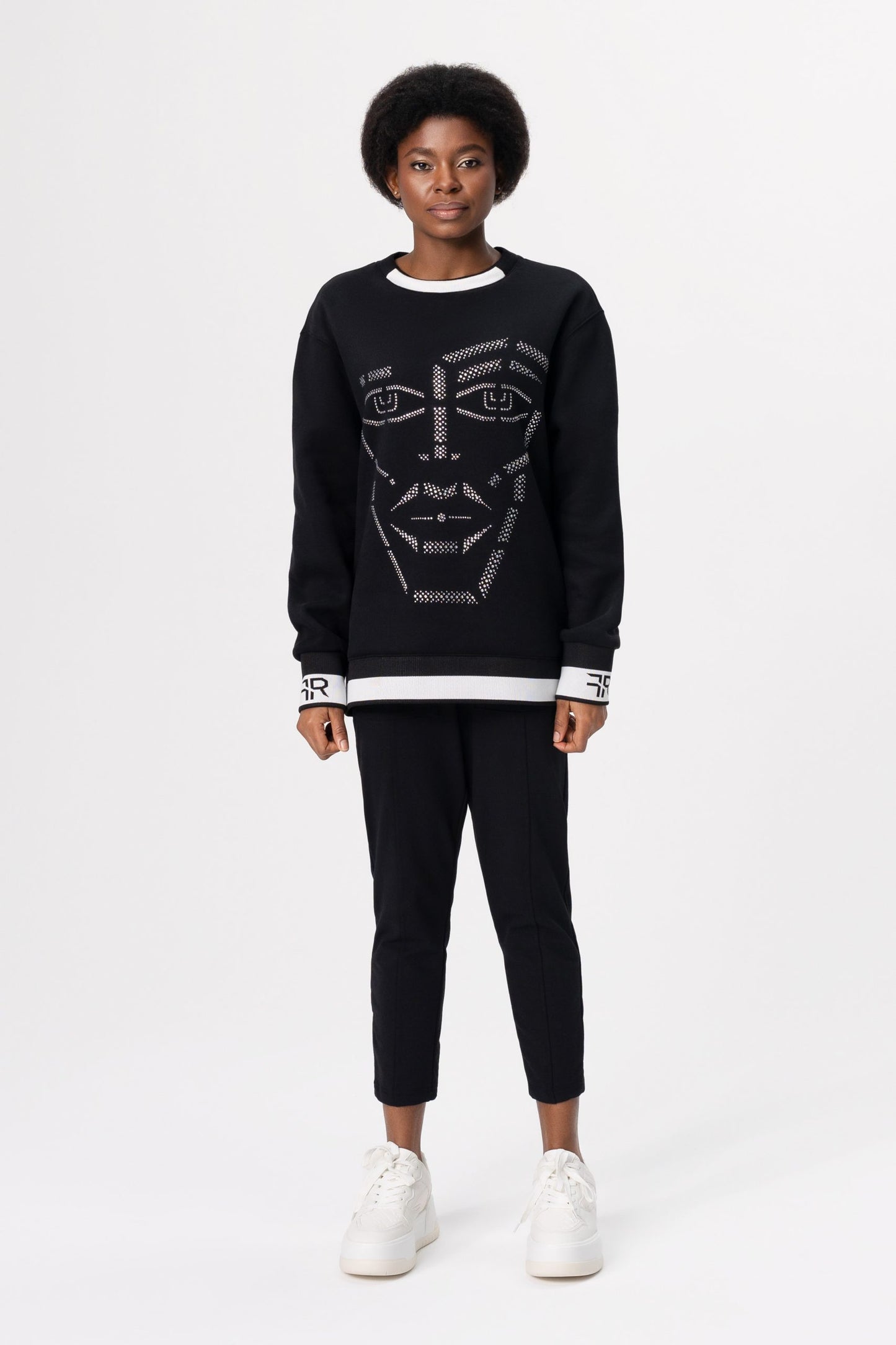 Crystal-Encrusted Unisex Sweatshirt with the crystal-encrusted face silhouette on the front is a nod to motifs from the Freisi paintings collection