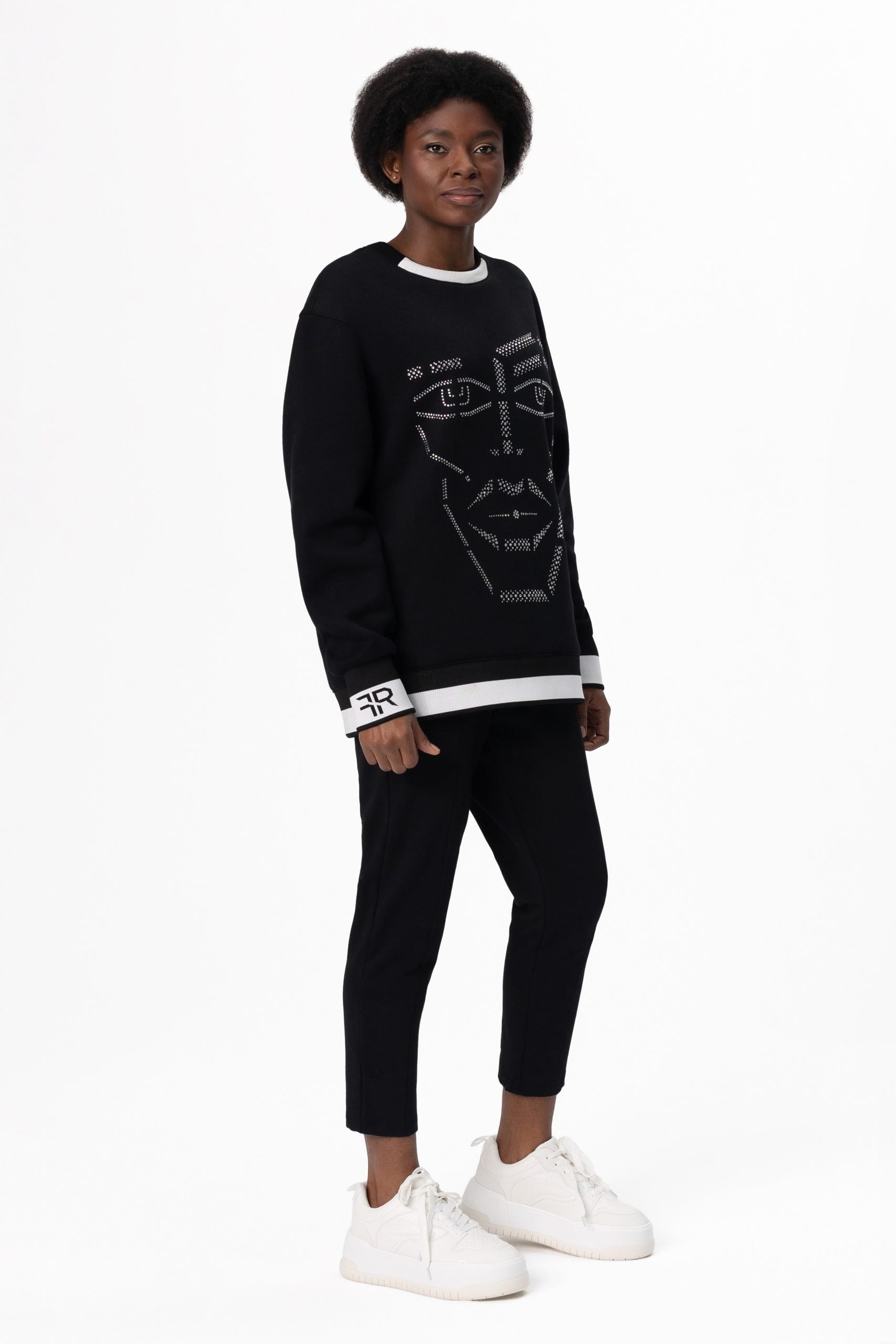 Crystal-Encrusted Unisex Sweatshirt with the crystal-encrusted face silhouette on the front is a nod to motifs from the Freisi paintings collection