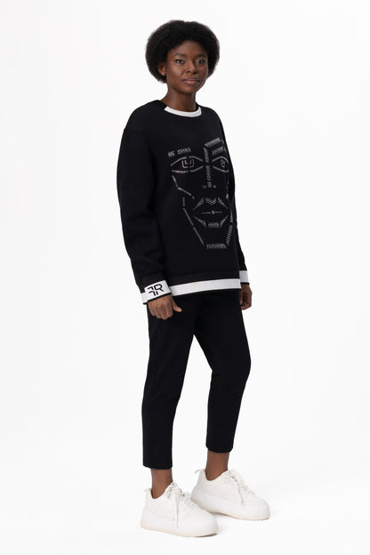Crystal-Encrusted Unisex Sweatshirt with the crystal-encrusted face silhouette on the front is a nod to motifs from the Freisi paintings collection