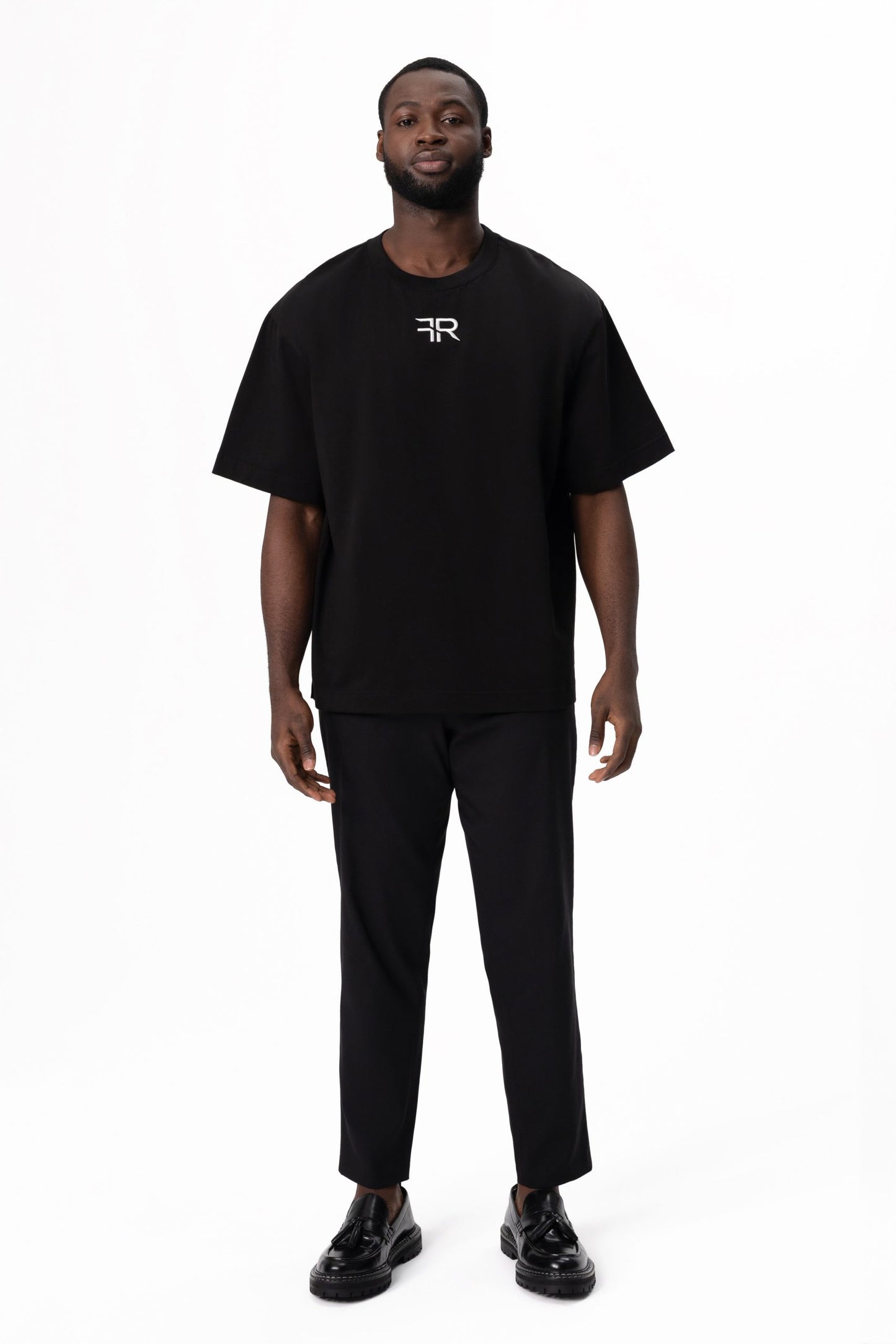 A branded gold metal and leather label on the reverse