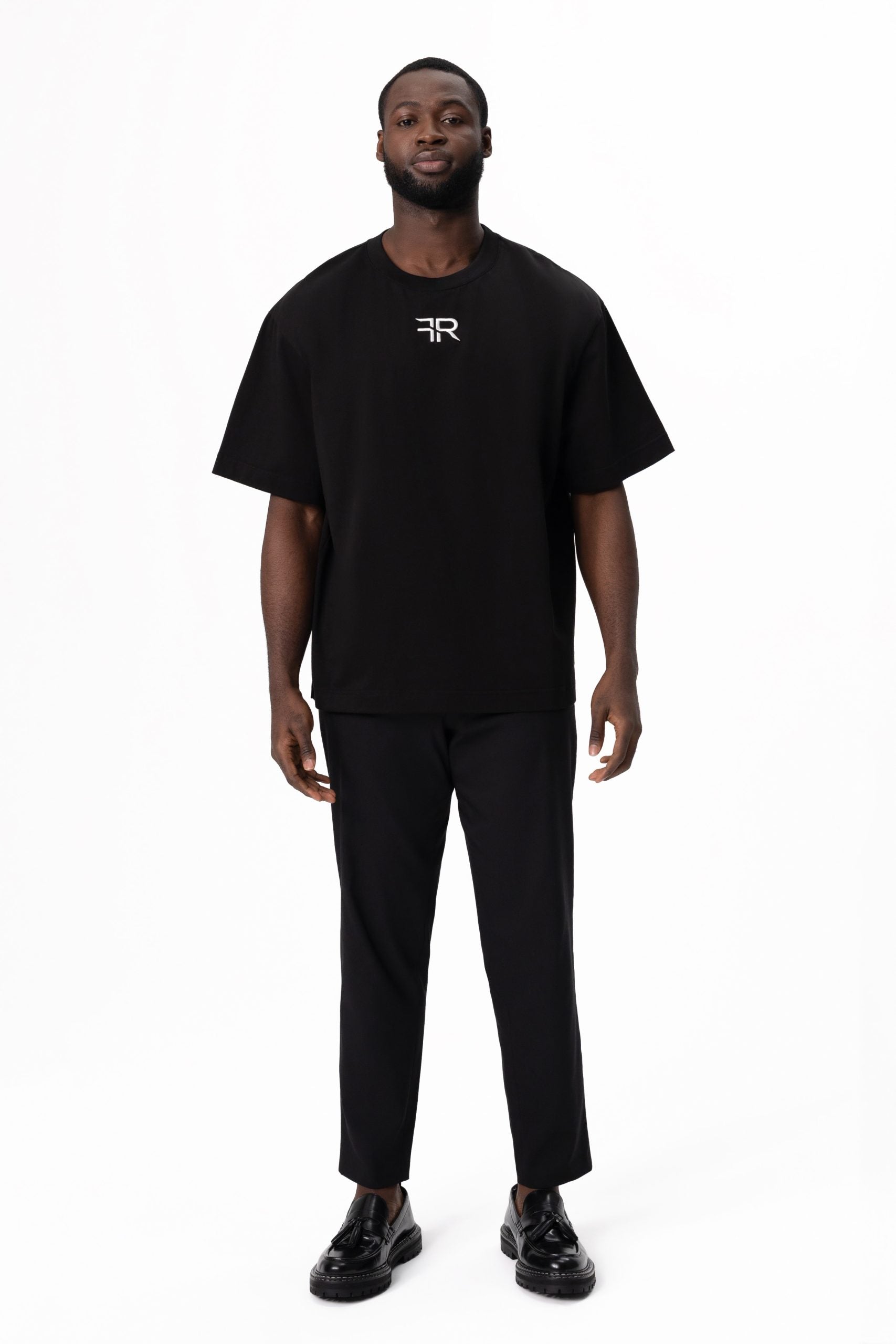 A branded gold metal and leather label on the reverse