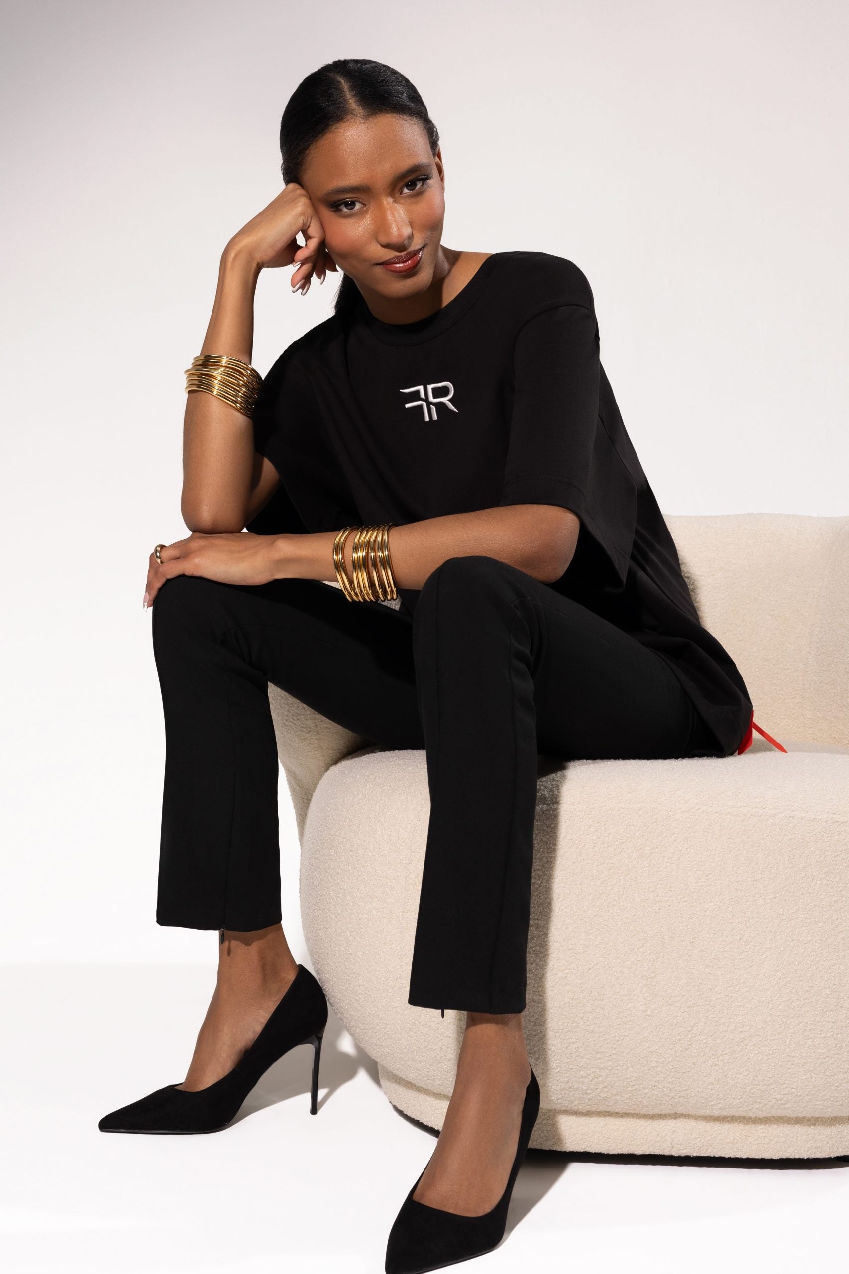 A branded gold metal and leather label on the reverse