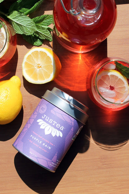 JusTea PURPLE RAIN | Loose Leaf Purple Tea | Tin with Hand Carved Tea Spoon | 40+ Cups (2.8oz) | Very Low Caffeine | Award-Winning | Fair Trade | Non-GMO